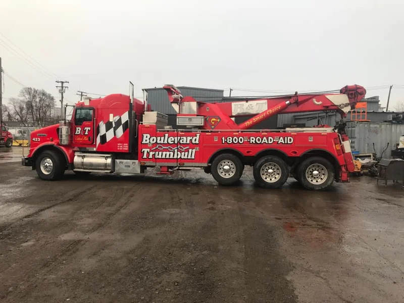 B&T heavy wrecker recovering overturned tanker on highway